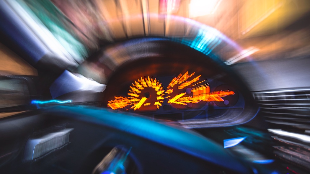 drivier in speeding car